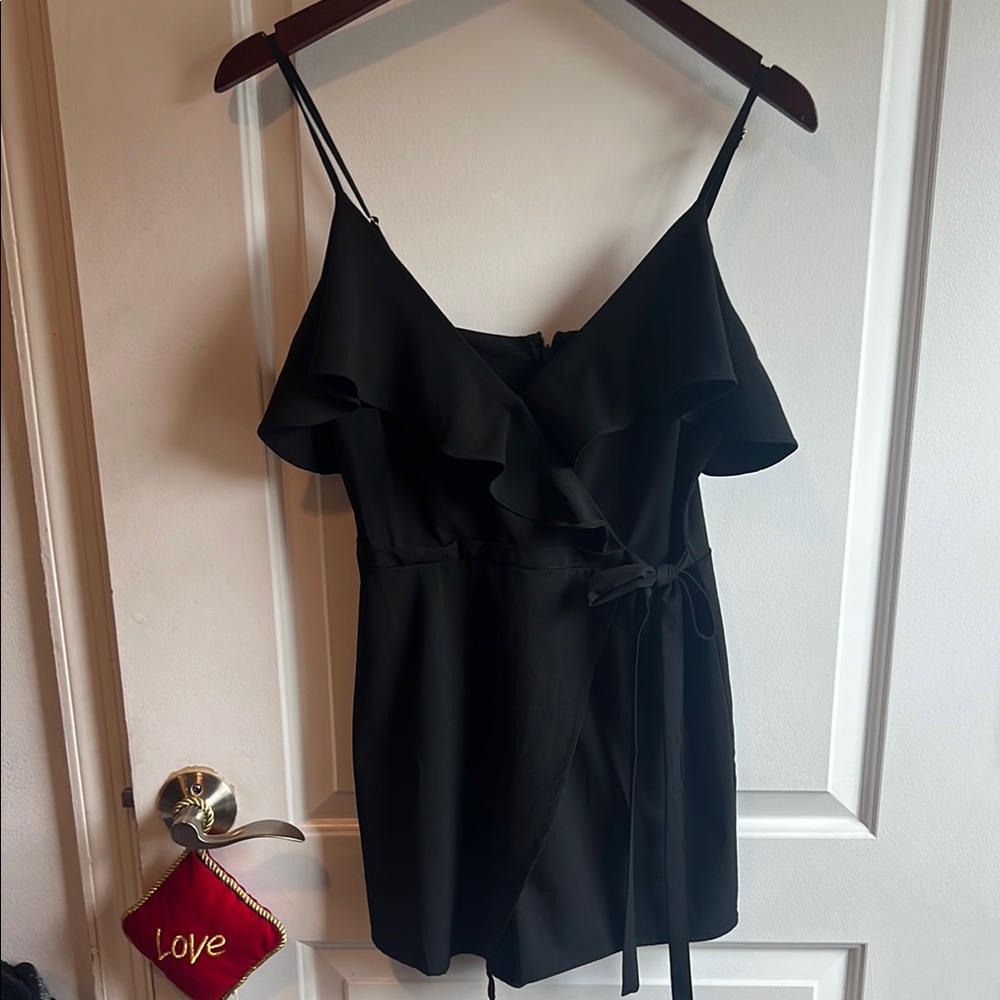 NWT Chic Black Mini Romper with Timeless Appeal